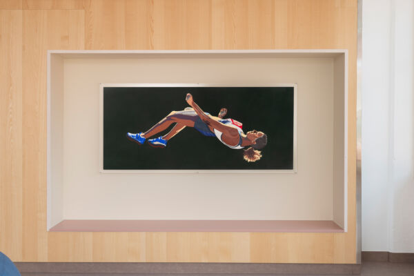 Foto av et maleri hengende over en sittenisje.